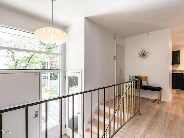 3205 Dell Dr, Raleigh, NC 27609 - hall featuring an upstairs landing, light wood finished floors, and healthy amount of natural light