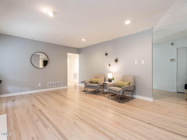 3205 Dell Dr, Raleigh, NC 27609 - sitting room with light wood-type flooring and recessed lighting