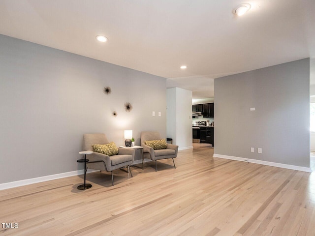 3205 Dell Dr, Raleigh, NC 27609 - sitting room with light wood finished floors and recessed lighting