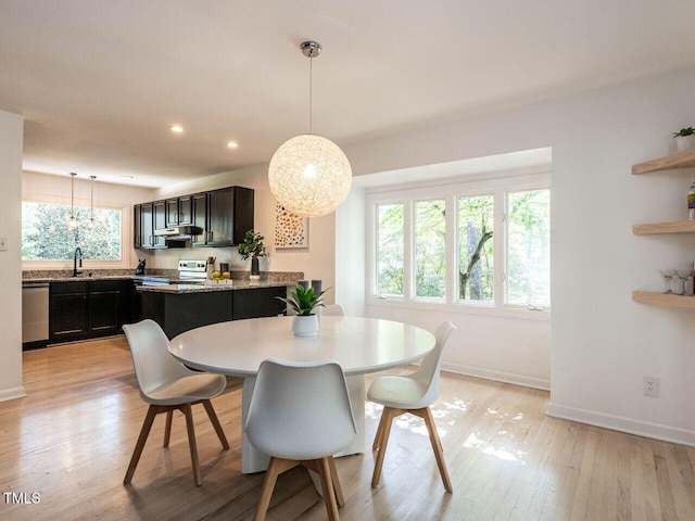 3205 Dell Dr, Raleigh, NC 27609 - dining space with light wood-style flooring and recessed lighting