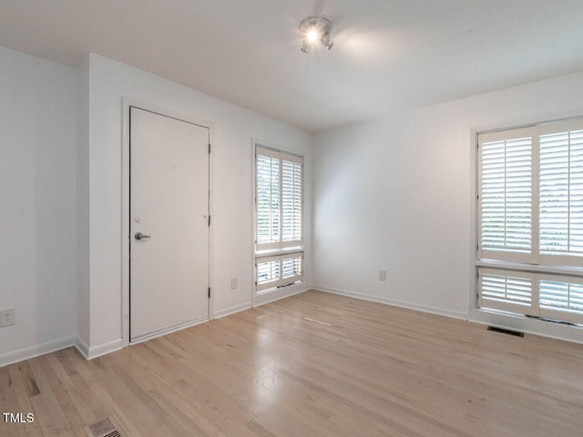 3205 Dell Dr, Raleigh, NC 27609 - spare room featuring light wood-type flooring and baseboards