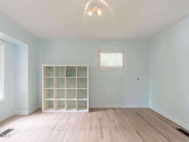 3205 Dell Dr, Raleigh, NC 27609 - spare room with wood finished floors and baseboards