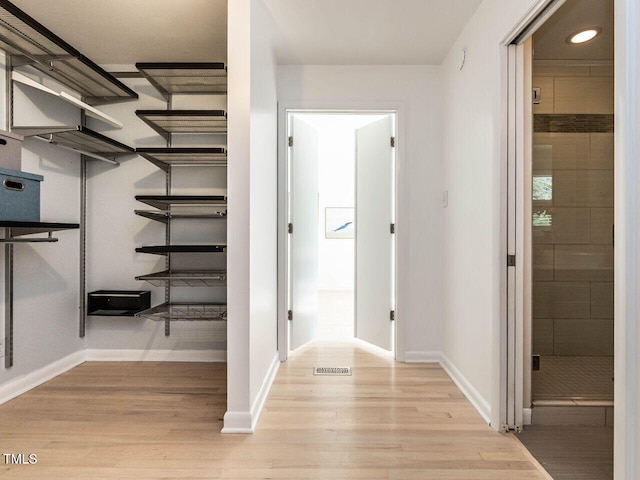 3205 Dell Dr, Raleigh, NC 27609 - hallway featuring light wood finished floors and recessed lighting