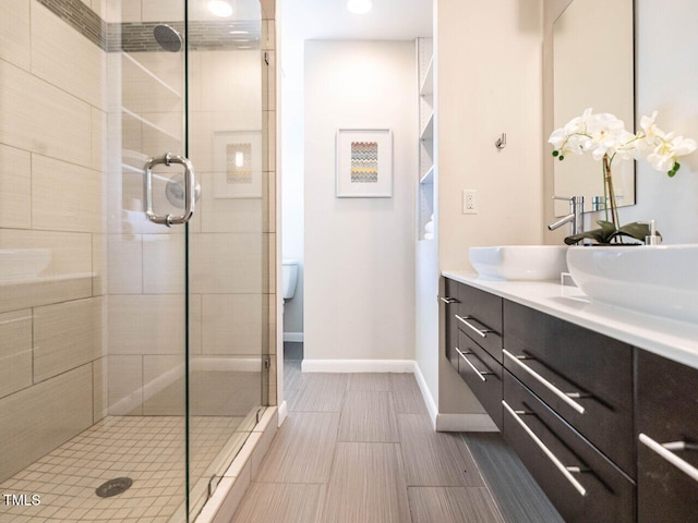 3205 Dell Dr, Raleigh, NC 27609 - bathroom featuring a stall shower and double vanity