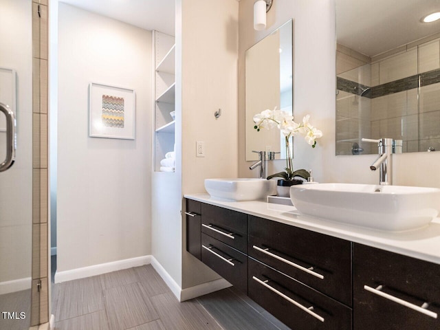 3205 Dell Dr, Raleigh, NC 27609 - bathroom with double vanity and a tile shower