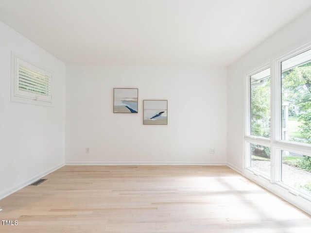 3205 Dell Dr, Raleigh, NC 27609 - unfurnished room featuring healthy amount of natural light and light wood-style floors