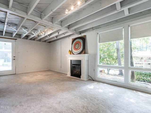 3205 Dell Dr, Raleigh, NC 27609 - unfurnished living room featuring carpet floors and a glass covered fireplace