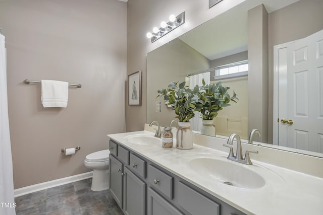 211 Cloverdale Dr, Durham, NC 27703 - full bath featuring double vanity and wood finished floors