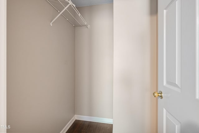 211 Cloverdale Dr, Durham, NC 27703 - walk in closet featuring dark wood-style flooring