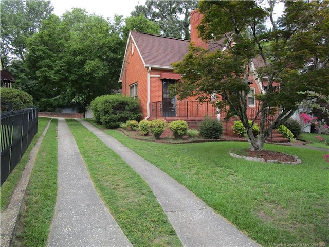 432 Rollingwood Cir, Fayetteville, NC 28305 - view of side of property with brick siding, a chimney, and a shingled roof