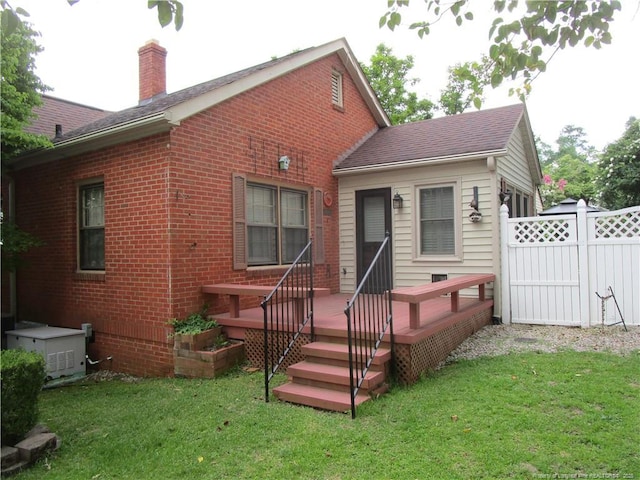 432 Rollingwood Cir, Fayetteville, NC 28305 - view of front of property featuring a wooden deck, brick siding, a chimney, an attached garage, and a shingled roof