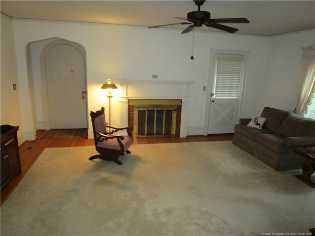 432 Rollingwood Cir, Fayetteville, NC 28305 - living area featuring ceiling fan, a fireplace, and wood finished floors