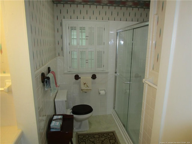 432 Rollingwood Cir, Fayetteville, NC 28305 - full bathroom featuring tile walls, a stall shower, tile patterned floors, and wallpapered walls