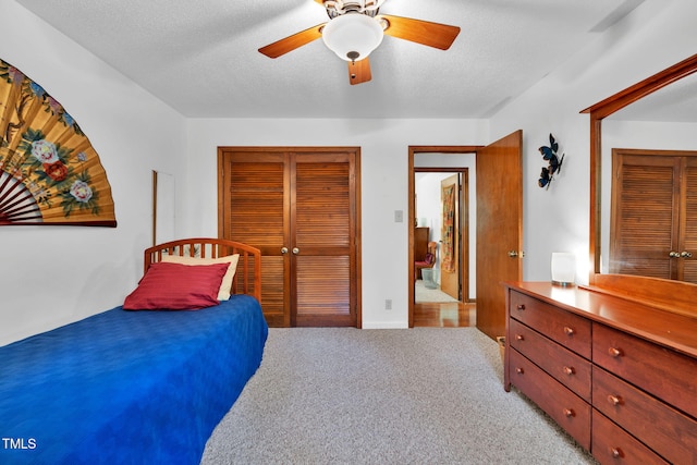 4134 King Charles Rd, Durham, NC 27707 - bedroom with a closet, light carpet, ceiling fan, and a textured ceiling