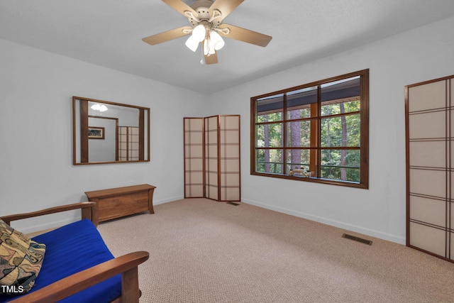 4134 King Charles Rd, Durham, NC 27707 - living area with carpet floors and a ceiling fan