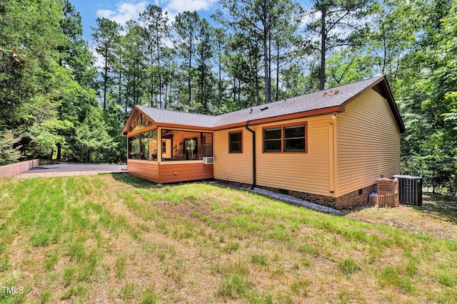 4134 King Charles Rd, Durham, NC 27707 - back of property featuring a shingled roof, crawl space, and a lawn