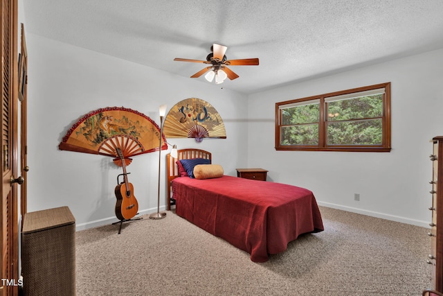 4134 King Charles Rd, Durham, NC 27707 - carpeted bedroom featuring a textured ceiling and ceiling fan