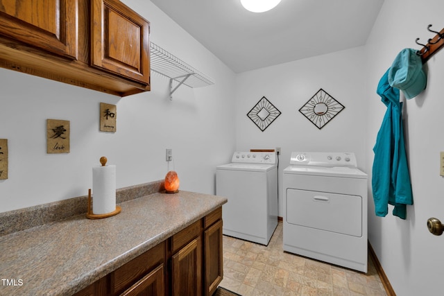 4134 King Charles Rd, Durham, NC 27707 - washroom with independent washer and dryer, cabinet space, and stone finish flooring