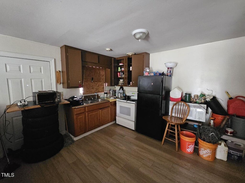 401 S Raleigh St A-B, Unit A-B Angier, NC 27501 - kitchen with white appliances and dark wood-style floors