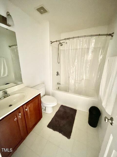 6328 Bermuda Way, Whitsett, NC 27377 - bathroom with vanity, shower / bath combo, and tile patterned flooring
