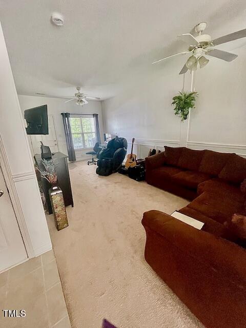 6328 Bermuda Way, Whitsett, NC 27377 - living area with a ceiling fan and light colored carpet