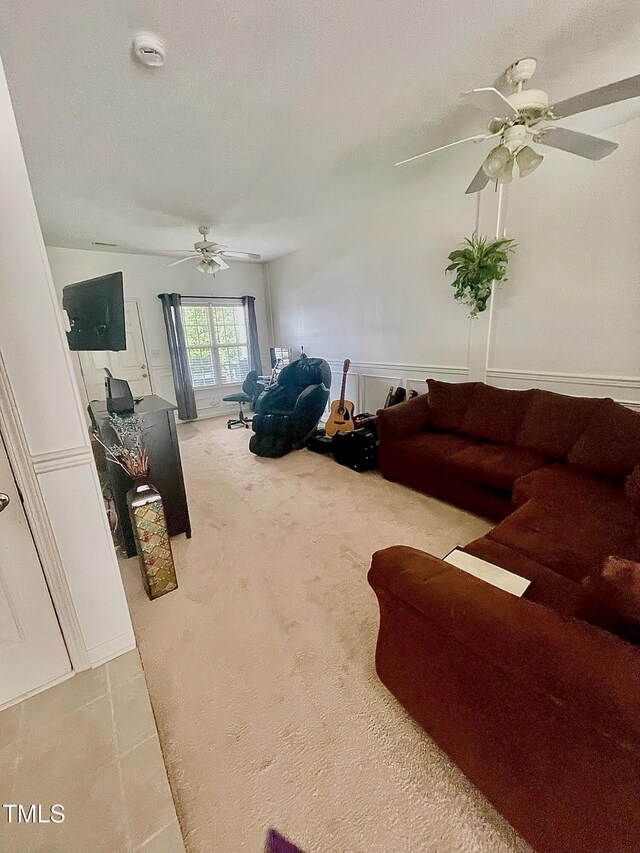 6328 Bermuda Way, Whitsett, NC 27377 - living room featuring a ceiling fan and light carpet