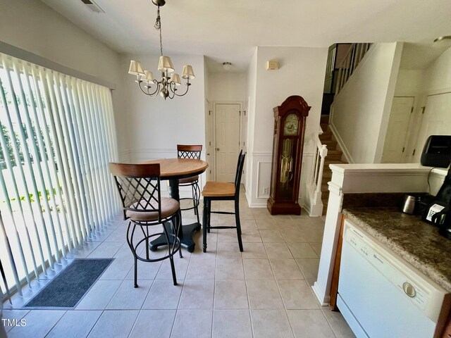 6328 Bermuda Way, Whitsett, NC 27377 - dining area with plenty of natural light, a chandelier, light tile patterned floors, stairway, and wainscoting