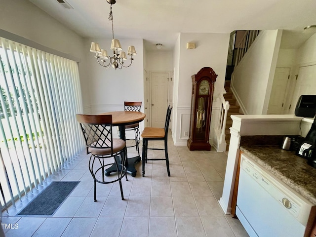 6328 Bermuda Way, Whitsett, NC 27377 - dining area with plenty of natural light, a chandelier, light tile patterned floors, stairway, and wainscoting