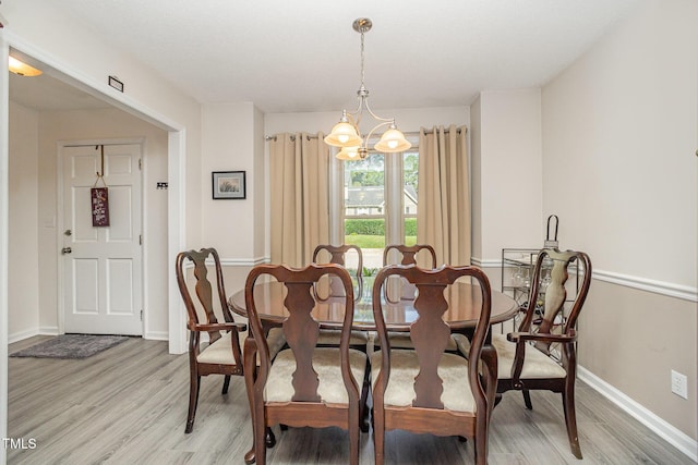 5538 Sharpe Dr, Raleigh, NC 27612 - dining room with light wood-type flooring and a chandelier