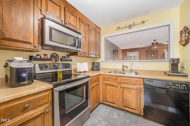 5538 Sharpe Dr, Raleigh, NC 27612 - kitchen featuring appliances with stainless steel finishes, light countertops, brown cabinets, and ceiling fan