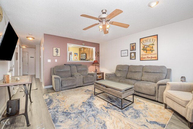 5538 Sharpe Dr, Raleigh, NC 27612 - living room featuring a ceiling fan and wood finished floors