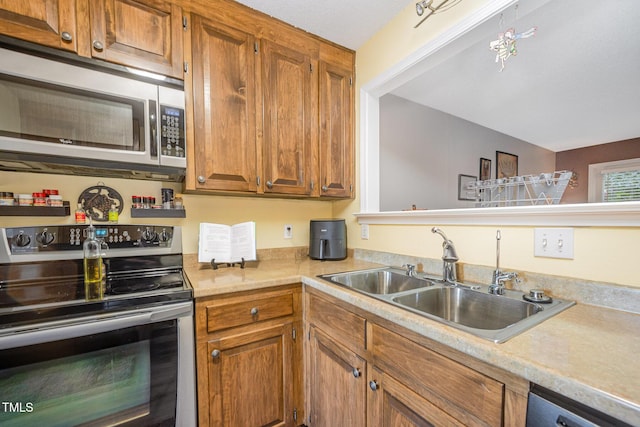 5538 Sharpe Dr, Raleigh, NC 27612 - kitchen with appliances with stainless steel finishes, light countertops, and brown cabinets