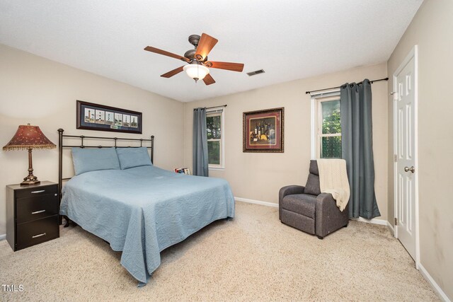 5538 Sharpe Dr, Raleigh, NC 27612 - carpeted bedroom with baseboards and ceiling fan