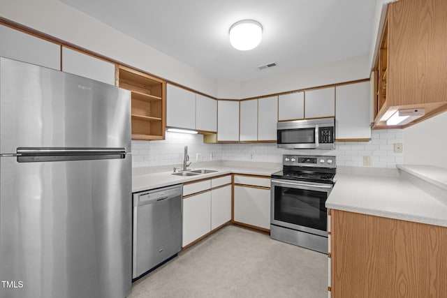 365 Summerwalk Cir, Chapel Hill, NC 27517 - kitchen with stainless steel appliances, open shelves, light countertops, and decorative backsplash