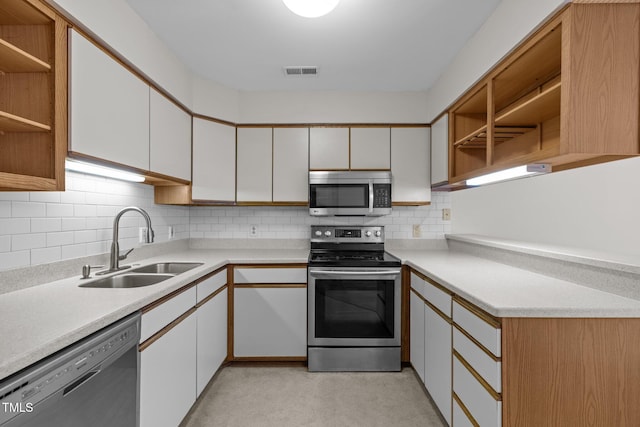 365 Summerwalk Cir, Chapel Hill, NC 27517 - kitchen featuring appliances with stainless steel finishes, open shelves, light countertops, and white cabinetry