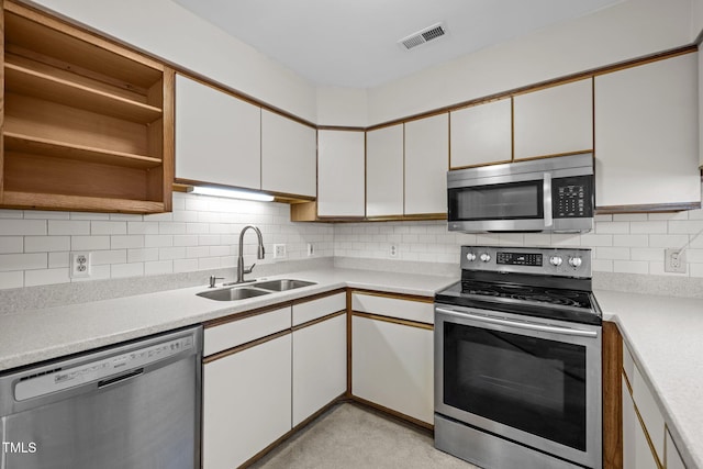 365 Summerwalk Cir, Chapel Hill, NC 27517 - kitchen featuring appliances with stainless steel finishes, open shelves, light countertops, decorative backsplash, and white cabinetry