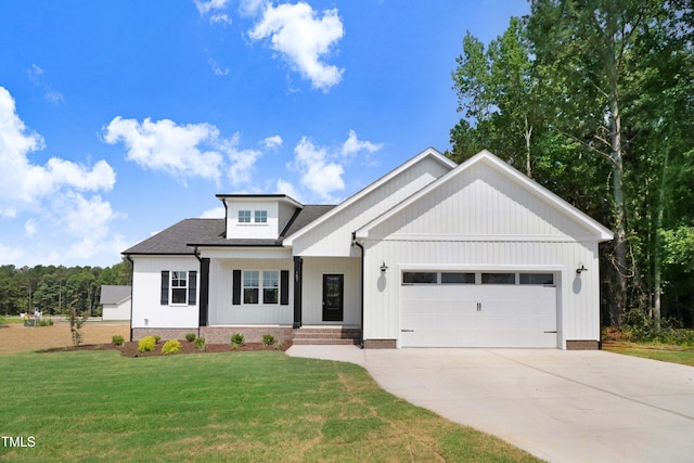 157 Cherrybirch Ln, Zebulon, NC 27597 - view of front of property featuring an attached garage, a front yard, driveway, and a shingled roof