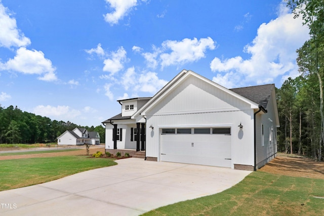 157 Cherrybirch Ln, Zebulon, NC 27597 - view of front of property featuring a garage, a front lawn, and concrete driveway