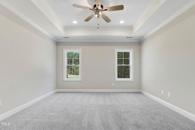 157 Cherrybirch Ln, Zebulon, NC 27597 - carpeted spare room featuring a tray ceiling, crown molding, a ceiling fan, and recessed lighting