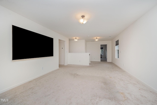 23 Walker Grove Ln, Lillington, NC 27546 - unfurnished living room featuring light carpet and baseboards