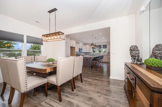23 Walker Grove Ln, Lillington, NC 27546 - dining area featuring wood finished floors, recessed lighting, and a chandelier