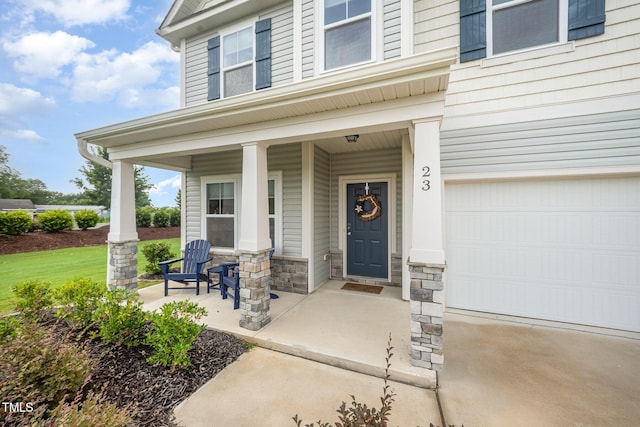 23 Walker Grove Ln, Lillington, NC 27546 - property entrance with covered porch, a garage, and stone siding