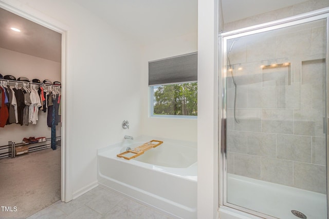 23 Walker Grove Ln, Lillington, NC 27546 - full bath with a bath, a stall shower, a walk in closet, and tile patterned flooring