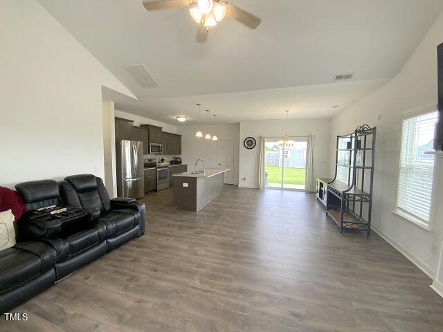 101 Mutton Dr, Pikeville, NC 27863 - living area with ceiling fan and dark wood-type flooring