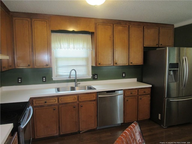 108 Shady Meadows Ln, Clayton, NC 27520 - kitchen featuring stainless steel appliances, brown cabinetry, light countertops, and dark wood-style floors