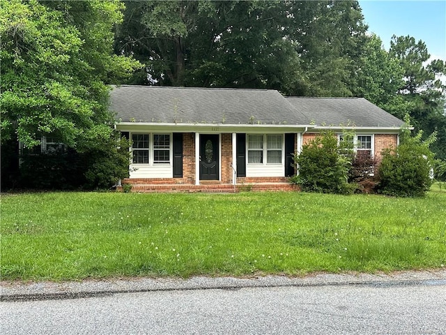 1121 Patrick Dr, Fayetteville, NC 28314 - single story home featuring a front yard and brick siding