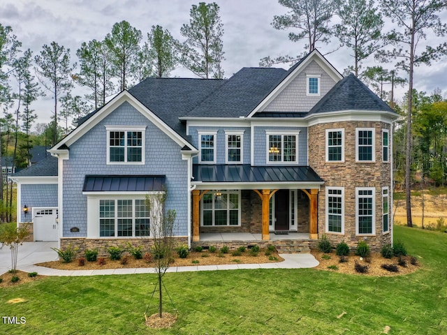 3526 Clifton Park Ct, New Hill, NC 27562 - view of front of home with stone siding, a standing seam roof, covered porch, and an attached garage
