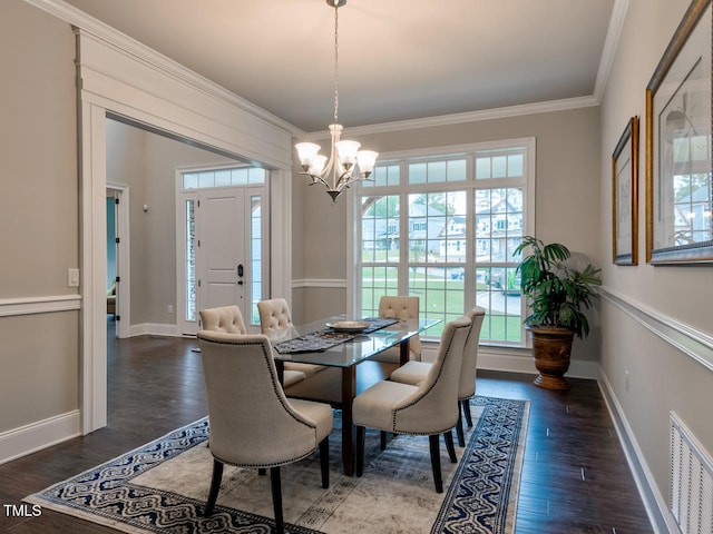 3526 Clifton Park Ct, New Hill, NC 27562 - dining area featuring wood finished floors, ornamental molding, and a chandelier