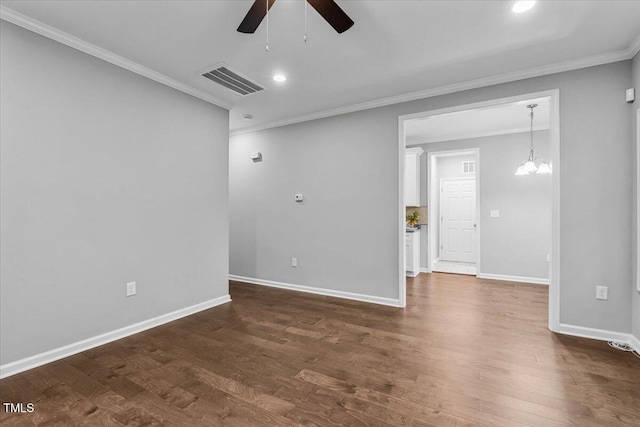 213 Guerrant St, Greensboro, NC 27401 - spare room with ceiling fan, crown molding, dark wood finished floors, recessed lighting, and a chandelier