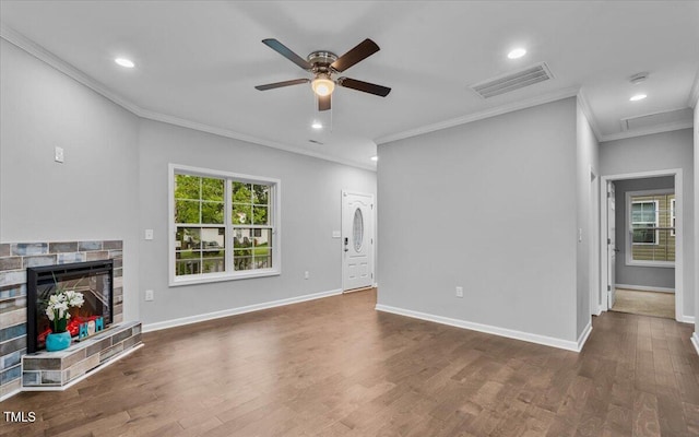 213 Guerrant St, Greensboro, NC 27401 - unfurnished living room with ornamental molding, ceiling fan, wood finished floors, a stone fireplace, and recessed lighting